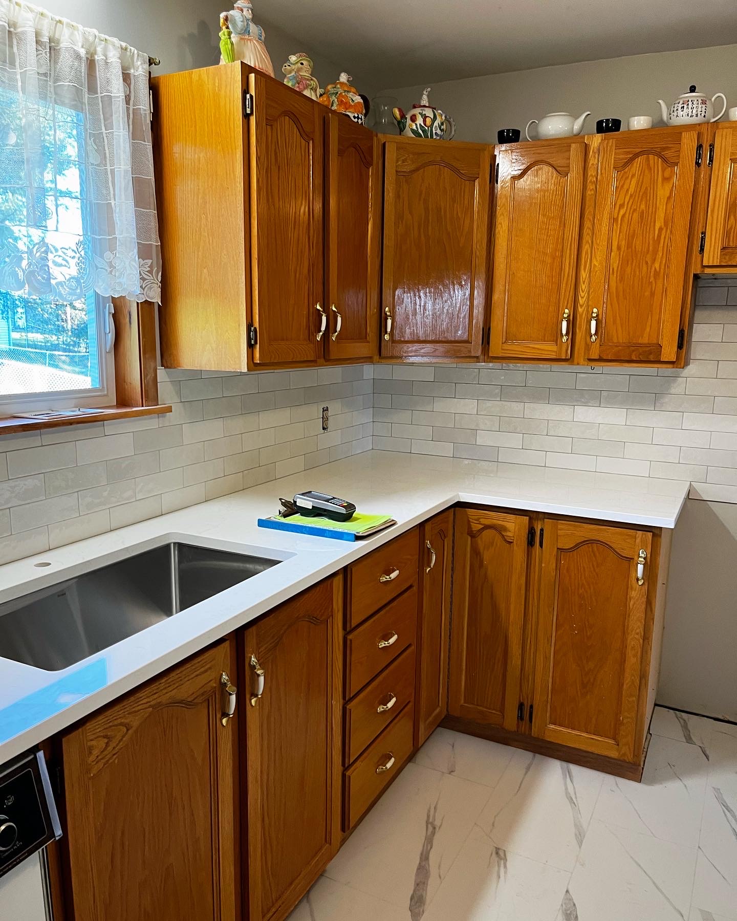 A new Quartz countertop to brighten this classic kitchen look with a subway tile backsplash and undermount sink