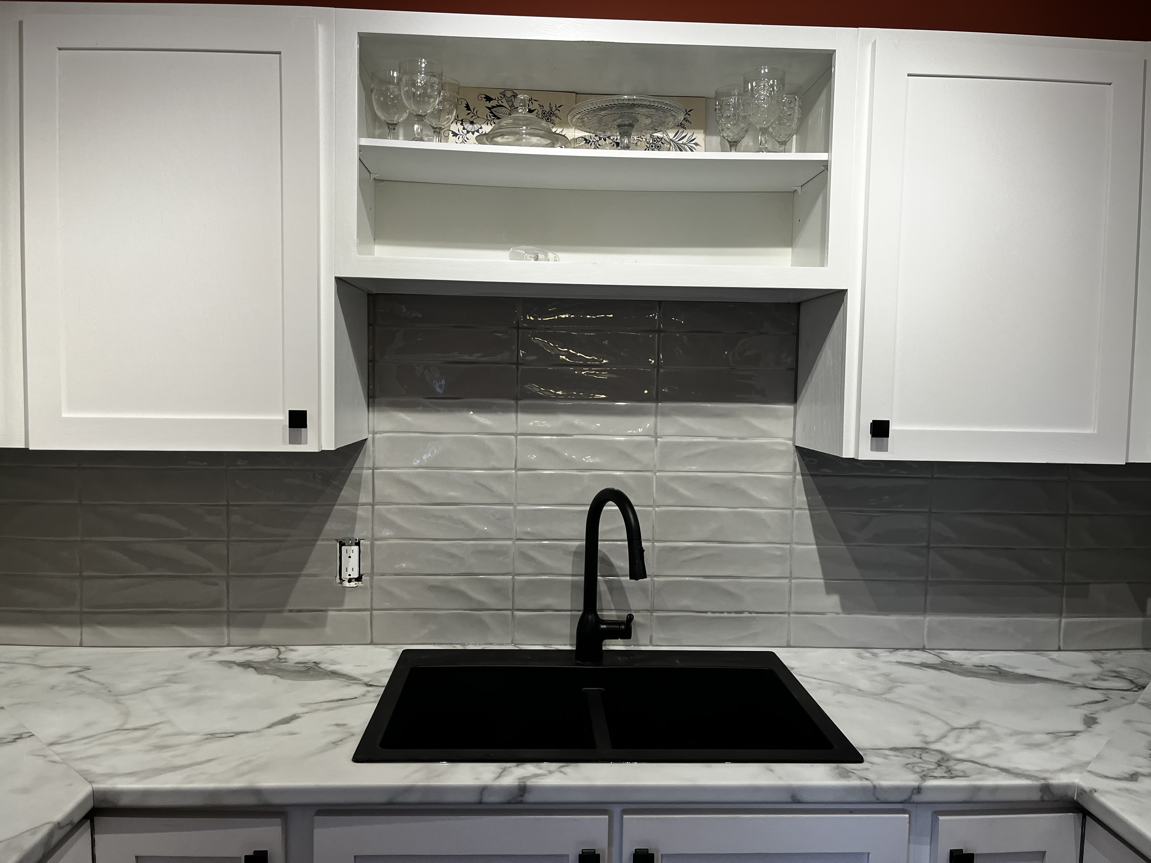 Would you believe it’s not Quartz?  A remarkable laminate design complete with a black granite sink and white cabinets