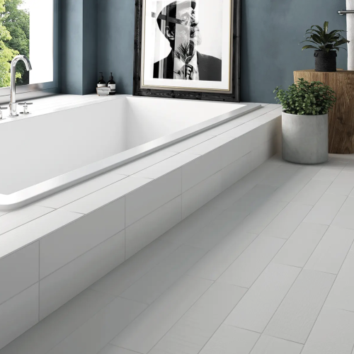white subway tile flooring in bathroom